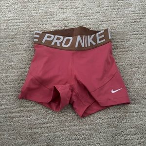Nike pros(ideally worn while working out/running), size XS, pink with brown band